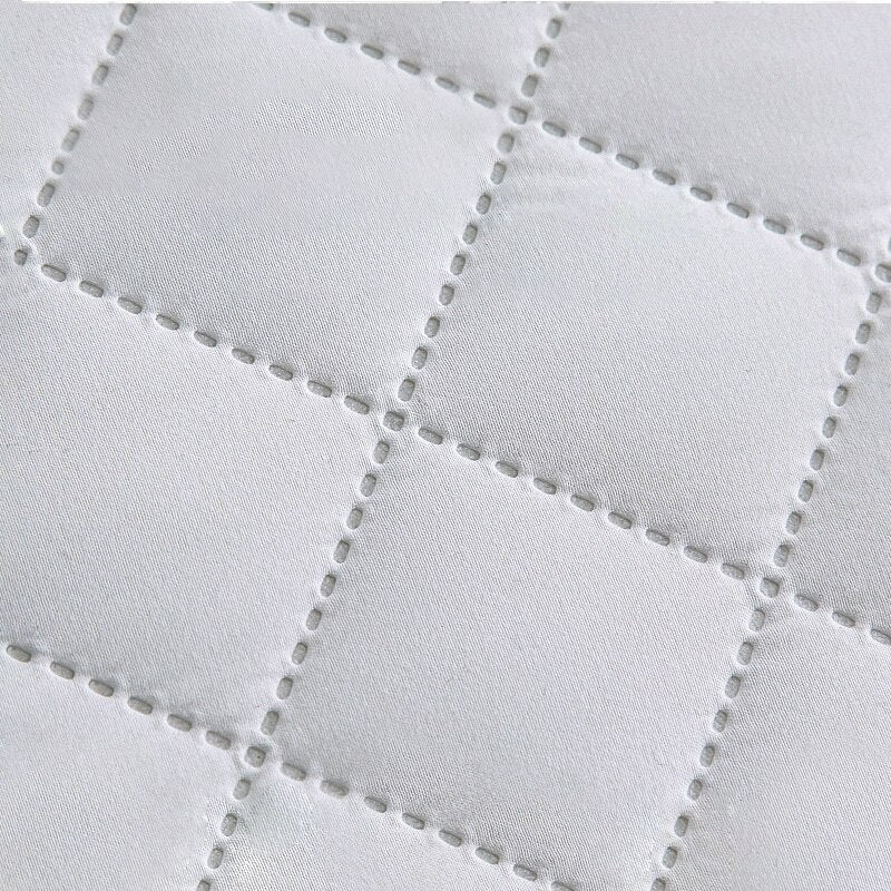 protège matelas sérénité matelassée blanc pur texture matelassée motif losanges